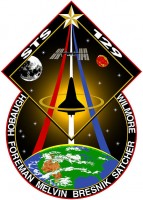 Het logo van STS-129