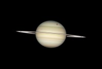 Saturnus en vier van zijn manen