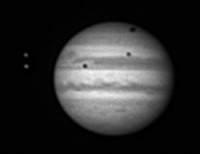 Jupiter en de schaduwen van enkele maande, gefotografeerd door Cees Aarnoutse